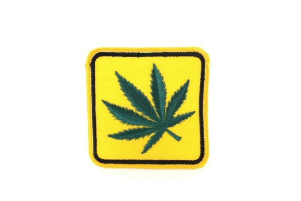 Rasta Patch Cannabis Leaf on Yellow Road Sign